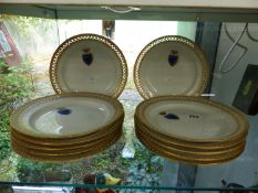 A SET OF TWELVE BERLIN PORCELAIN LATTICE EDGE PLATES WITH ARMORIAL PAINTED CREST