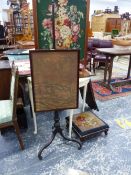 AN ANTIQUE MAHOGANY POLE SCREEN TOGETHER WITH A FIRESCREEN AND A SET OF BELLOWS.