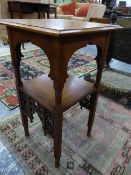 A MAHOGANY TWO TIER TABLE, AN OGEE BRACKET APRON TO THE UPPER TIER AND MISHRABIYE TO THE LOWER,