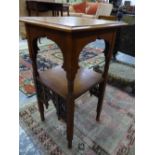 A MAHOGANY TWO TIER TABLE, AN OGEE BRACKET APRON TO THE UPPER TIER AND MISHRABIYE TO THE LOWER,