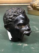 A 19th C. EBONY WALKING CANE HANDLE CARVED AS AN AFRICAN HEAD, ONCE WITH A LEVER TO MOVE THE EYES AN