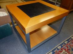 A PAIR OF TWO TIER COFFEE TABLES, BLOND WOOD FRAMING SQUARES OF BLACK ON THE TOPS, THE SQUARE GREY