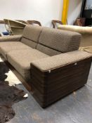 A TWO SEAT SETTEE WITH CALAMANDER WOOD BACK AND SIDES UPHOLSTERED IN BROWN CHEQUERED MATERIAL. W