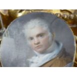 AN 18th C. WATERCOLOUR PORTRAIT MINIATURE OF AN ARTIST WITH BRUSH IN HAND, HE WEARS A BROWN JACKET,