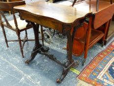 A VICTORIAN ROSEWOOD WORK TABLE ON CARVED SUPPORTS.
