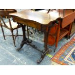 A VICTORIAN ROSEWOOD WORK TABLE ON CARVED SUPPORTS.