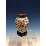 A CHINESE FAMILLE VERTE OVOID JAR, CARVED WOOD COVER AND STAND, THE BODY PAINTED WITH RED AND YELLOW