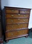 AN 18th C. OAK CHEST OF TWO SHORT AND FOUR GRADED LONG DRAWERS ON BUN FEET. W 101 x D 53 x H