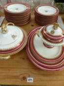 A MID VICTORIAN ROYAL WORCESTER PART DINNER SERVICE, CIRCA 1871 WITH ARMORIAL CREST TO CENTRE