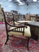 AN EDWARDIAN MARQUETRIED ROSEWOOD THREE PIECE SUITE, THE SERPENTINE TOP RAILS CENTRED BY OVAL