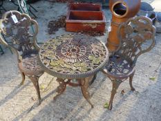 SMALL CAST IRON GARDEN TABLE AND TWO CHAIRS