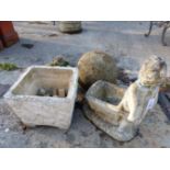 A STONE BALL AND TWO GARDEN ORNAMENTS, PLANTERS ETC