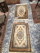 A PAIR OF PERSIAN KASHAN MATS, 110 x 64cms (2)