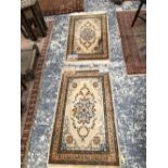 A PAIR OF PERSIAN KASHAN MATS, 110 x 64cms (2)