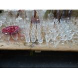 AN EXTENSIVE COLLECTION OF GLASSWARE TO INCLUDE THREE ANTIQUE PEWTER MOUNTED DECANTERS, VASES ETC