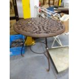 A VICTORIAN TOPPED IRON TABLE, THE CIRCULAR TOP PIERCED AND CAST WITH FIVE FLOWER HEAD CENTRED