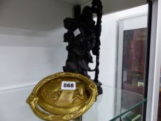 A BRASS DOOR KNOCKER AND AN ORIENTAL STYLE FIGURE.