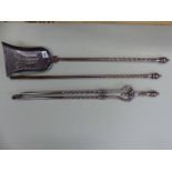 A SET OF THREE ANTIQUE POLISHED STEEL FIRE IRONS, EACH WITH BALUSTER HANDLES AND SPIRAL TWIST COLU