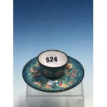 A PEKING ENAMEL TEA BOWL AND SAUCER, THE TURQUOISE GROUND PAINTED WITH FRUIT AND FLOWERS