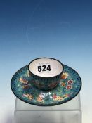 A PEKING ENAMEL TEA BOWL AND SAUCER, THE TURQUOISE GROUND PAINTED WITH FRUIT AND FLOWERS