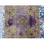 A MIDDLE EASTERN PURPLE SILK VELVET PANEL WORKED IN GOLD THREAD WITH A FLORAL SQUARE ROSETTE