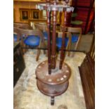 AN ANTIQUE MAHOGANY REVOLVING BILLIARD CUE STICK STAND, H. 141cms