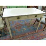 A 19th C. CREAM PAINTED SIDE TABLE, THE RECTANGULAR TOP ABOVE TWO DRAWER AND THE TAPERING