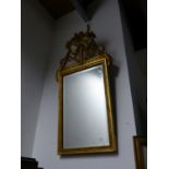 AN ANTIQUE CONTINENTAL CARVED GILTWOOD NEO CLASSICAL STYLE MIRROR. 25 x 100cms