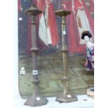 A PAIR OF VICTORIAN GOTHIC GILT BRASS CANDLE STICKS