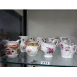 A QUANTITY OF TWELVE ROYAL WORCESTER SMALL PORCELAIN JUGS.