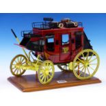 A VINTAGE WELL BUILT MODEL OF A ROYAL MAIL OVERLAND EXPRESS CARRIAGE MOUNTED ON WOODEN PLINTH