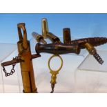 TWO 19th C. CORK SCREWS, A BRASS HANDLE UNSCREWING TO REVEAL A CORK SCREW AND THREE OTHER TOOLS, A