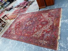 A MACHINE MADE CARPET OF PERSIAN HERIZ DESIGN, 340 x 233cms