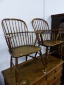 TWO SIMILAR ANTIQUE OAK AND ELM WINDSOR CHAIRS WITH SHALLOW SADDLE SEATS AND TURNED FRONT LEGS