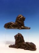 A PAIR OF BRONZED SPELTER RECLINING LIONS. W 25cms.