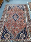 AN ANTIQUE PERSIAN SHIRAZ RUG 247 x 154cm