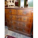 A LARGE EDWARDIAN MAHOGANY AND SATIN WOOD BANDED CHEST OF DRAWERS.