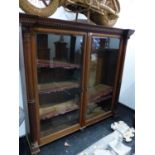 A 19th C. BEVELLED GLAZED OAK BOOKCASE, THE DENTIL CORNICE ABOVE COLUMNS FLANKING THE DOORS FLUTED