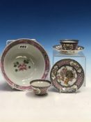 A PAIR OF CHINESE TEA BOWLS AND SAUCERS, EACH PAINTED WITH THREE FLORAL VIGNETTES ON A PINK