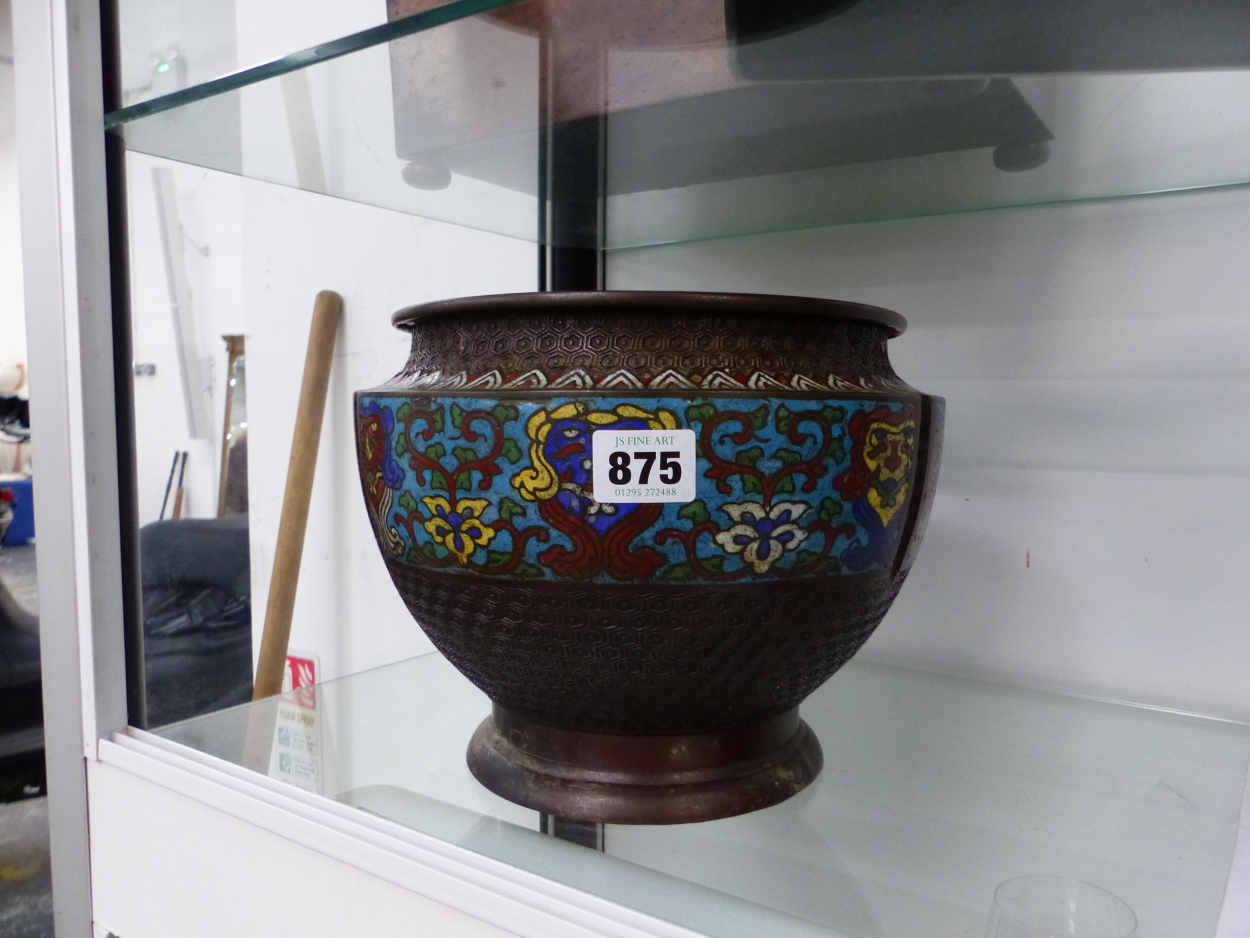 AN ORIENTAL BRONZE AND ENAMEL PLANTER.