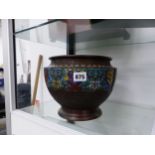 AN ORIENTAL BRONZE AND ENAMEL PLANTER.