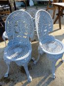 FOUR CAST METAL GARDEN CHAIRS