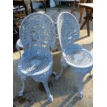 FOUR CAST METAL GARDEN CHAIRS