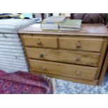 A SMALL VICTORIAN PINE CHEST OF DRAWERS.