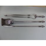 A SET OF THREE ANTIQUE POLISHED STEEL FIRE IRONS EACH WITH BALUSTER HANDLES