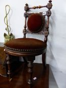 A PAIR OF VICTORIAN MAHOGANY CHILDREN'S CHAIRS, THE CIRCULAR BACK CENTRES AND SEATS CLOSE NAILED