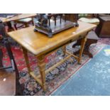 AN ARTS AND CRAFTS OAK TABLE, THE RECTANGULAR TOP RECESSED TO TAKE AN INSET ABOVE TWO DRAWERS WITH