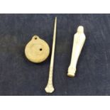 AN ANTIQUE AFRICAN IVORY PRAYING FIGURE, A IVORY HAIR STICK, AND A ROMAN OIL LAMP