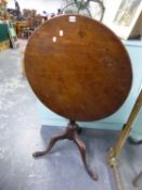 A GEORGE III MAHOGANY TILT TOP TRIPOD TABLE, THE CIRCULAR TOP ON BALUSTER COLUMN AND LEGS WITH LONG