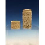 A CHINESE CARVED IVORY CYLINDRICAL BOX AND COVER DEPICTING VILLAGE SCENES IN LOW RELIEF. H 13cms.